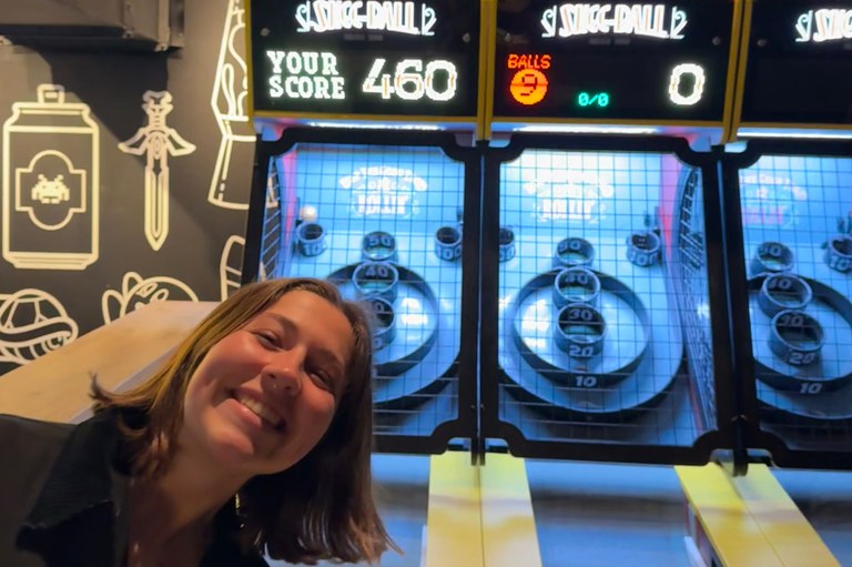 Celia playing Skee-ball