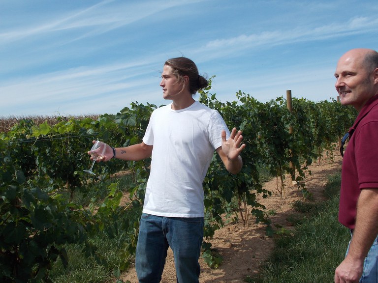 Zach Wilson in the vineyard with Mark