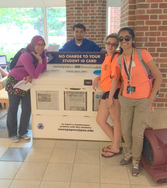 Graduate students Roshan Nayak and Nur Wahid on a global learning resources scavenger hunt with PGSAS participants