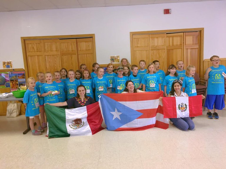 4-H kids in Tioga County with (left to right) Ilse (Mexico), Laura (Puerto Rico) and Mara (Peru) holding our flags