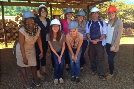 The group getting a tour of occupational health practices at a sawmill.