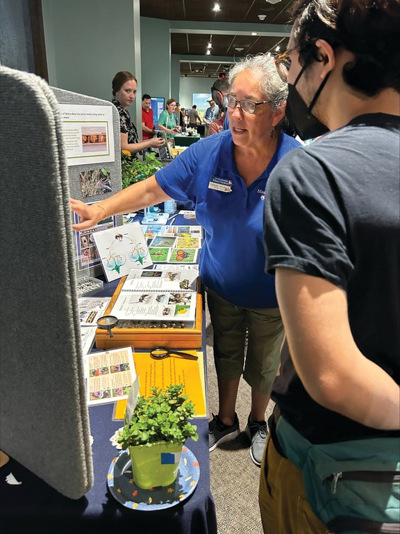 Master Gardener Consuelo Almodovar shares information about a bee monitoring project during Bug Fest, hosted by the Academy of Natural Sciences of Drexel University. 