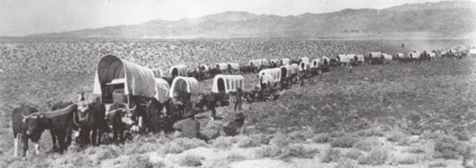 Thousands of pioneers traveled through the City of Rocks on their way to Oregon and California.  This National Park Service photo shows one wagon train on the road leading up to the granite spires.
