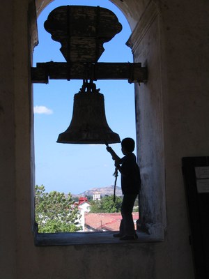 Boy ringing bell in Nicaraguan church