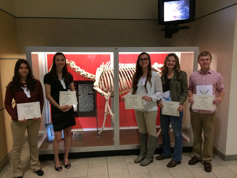 New members of Coaly Society in front of Coaly's Bones in the HUB-Robeson Center.