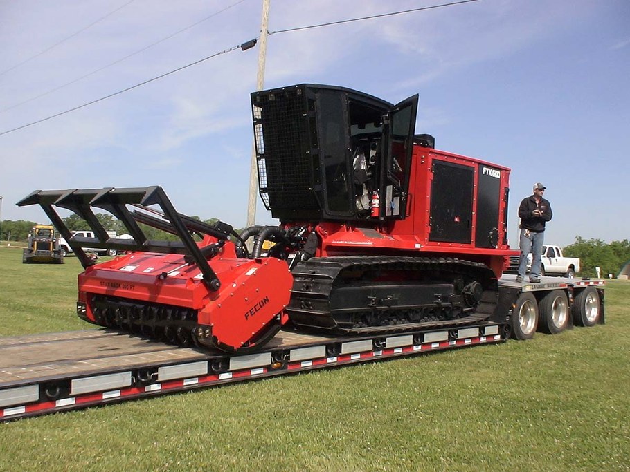 A Fecom machine with a mulching head for land clearing. 